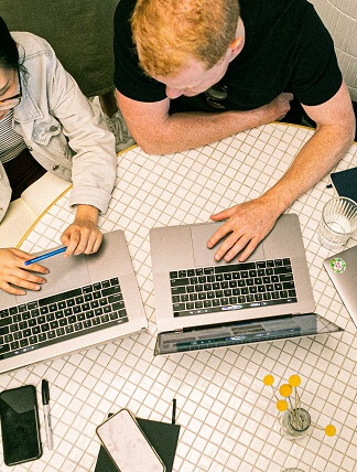 people working on a laptop